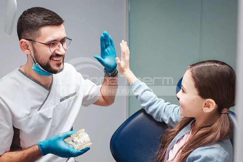 dentist-and-patient-celebrate